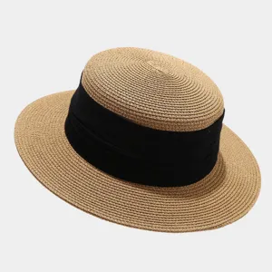 Detailed view of a stylish French vintage flat top straw hat featuring a black ribbon.