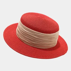 French vintage flat top straw hat detail, elegant red woven straw with wide beige ribbon.