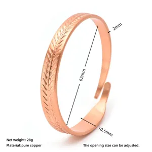 Detail view of copper open cuff bracelet with leaf texture and dimension measurements.