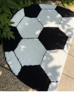 Round soccer ball rug detailed view, thick flocking anti-slip floor mat for home decor.