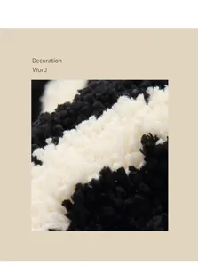 Close up view of black and white tufted carpet texture, soft plush bedside floor mat detail
