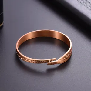 Minimalist pure copper cuff bracelet featuring an elegant leaf feather design, adjustable open band.
