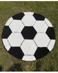Round soccer ball rug detailed view, thick flocked anti-slip floor mat for home decor.