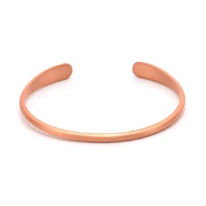 Pure copper open cuff bracelet detail view, smooth metal finish, minimalist jewelry style.