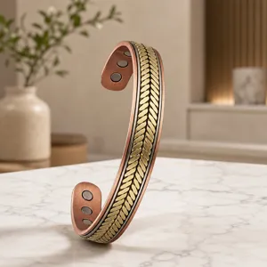 Close-up detail of the vintage copper magnetic cuff bracelet featuring a textured wheat pattern.
