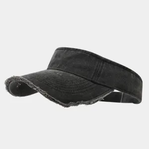 Distressed black sun visor cap detail, washed denim fabric texture, casual outdoor sports hat.