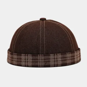 Vintage denim docker cap with plaid brim, retro street style roll watch cap detail.