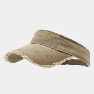 Detailed view of a vintage washed frayed sun visor hat, casual outdoor cotton empty top cap.