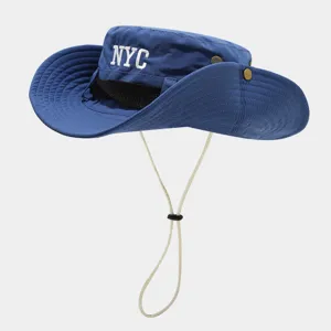 Close-up blue sun bucket hat detail, NYC embroidery, breathable mesh and adjustable chin cord.