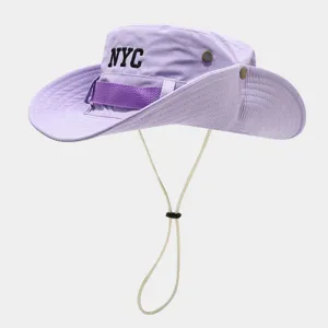 Purple bucket hat with NYC embroidery, adjustable chin cord, and breathable eyelets.