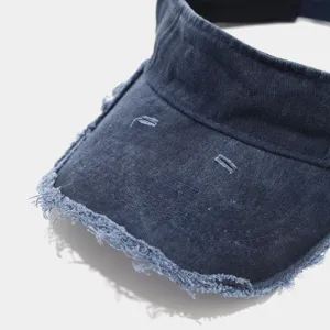 Washed distressed empty top sun hat detail view, retro vintage denim visor cap for outdoor.