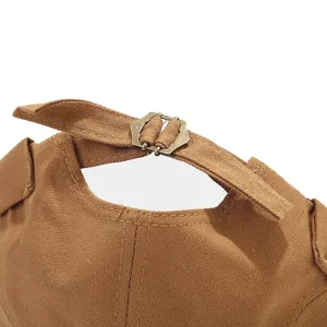 Close-up view of the adjustable canvas hat strap with metal buckle, retro brown style detail.