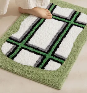 Thick absorbent bath mat with geometric pattern, non-slip floor rug for bathroom and home use.
