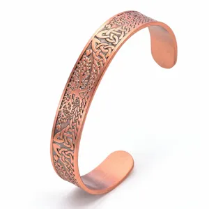 Vintage copper magnetic tree of life cuff bracelet detailed view showing engraved pattern.