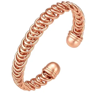 Rose gold layered spiral open cuff bracelet, elegant metal wrist jewelry for women.
