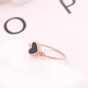 Rose gold titanium steel heart ring featuring black shell inlay and sparkling crystal detail.