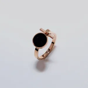 Rose gold titanium steel ring featuring black acrylic and geometric detail for women