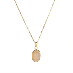 Gold stainless steel chain necklace oval pendant close up detail minimal aesthetic chic