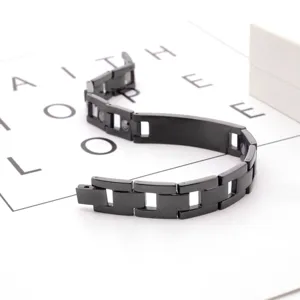Black titanium steel magnetic link bracelet detail showing sleek metallic finish and links.