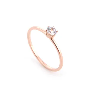 Rose gold stainless steel ring featuring a sparkling cubic zirconia solitaire for women main view.