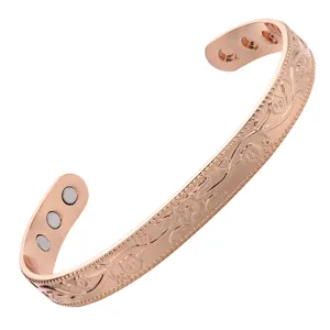 Rose gold magnetic copper open cuff bracelet with floral embossed design for elegant daily wear.