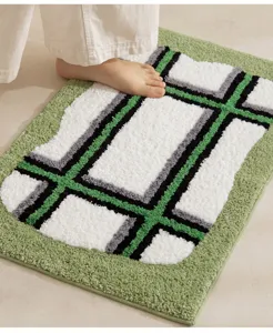 Thick plush bathroom mat with modern geometric grid design, highly absorbent and soft for home use.