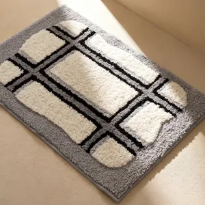 Modern absorbent non-slip bath mat with geometric pattern for bathroom and bedroom use.