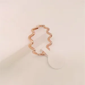 Minimalist rose gold wavy titanium steel ring for women, stylish everyday geometric finger jewelry.