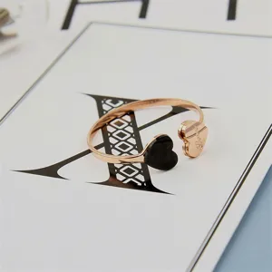 Simple rose gold open ring with black acrylic heart accent, stylish titanium steel jewelry.