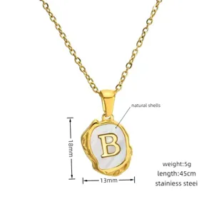 Stainless steel gold letter B pendant necklace with natural shell inlay, detail view.