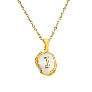 Gold-plated stainless steel chain with irregular mother of pearl letter J pendant detail.