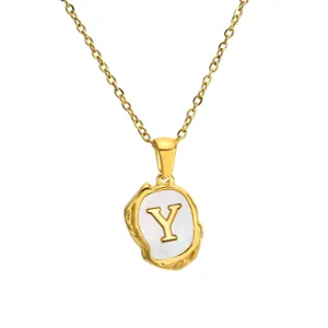 Gold stainless steel letter Y pendant necklace with mother of pearl detail. Delicate jewelry.