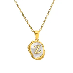 Gold stainless steel chain necklace featuring an irregular mother of pearl letter Z pendant style.