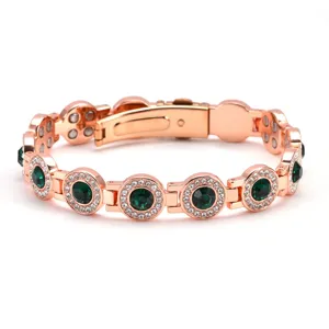 Rose gold magnetic bracelet with green crystal round stones and clear rhinestone pave.