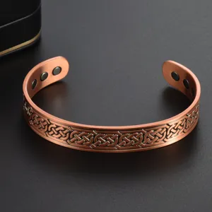 Vintage copper magnetic open cuff bracelet with Celtic infinity knot pattern and energy magnets.