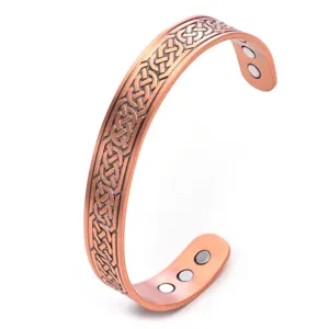 Copper magnetic therapy cuff bracelet with vintage Celtic knot pattern health jewelry detail