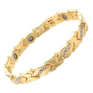 Detailed view of gold tone magnetic leaf bracelet with sparkling rhinestone inlay details.