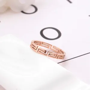 Rose gold titanium steel geometric cutout ring for women, stylish minimalist fashion jewelry.