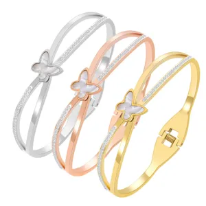 Elégant bracelet jonc papillon en acier inoxydable avec nacre et zircons brillants.