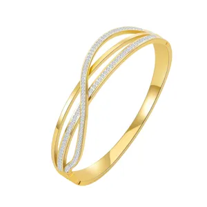 Gold plated stainless steel multi-strand crossover rhinestone paved luxury bangle detail view