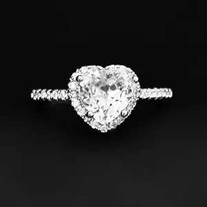 Detailed close-up of a stunning heart-shaped ring with dazzling pavé diamonds on band.