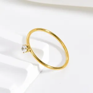 Minimalist gold stainless steel zircon ring detail view, simple elegant daily wear jewelry.