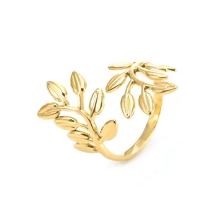 Close-up detail view of the gold leaf open ring, showing delicate branch and leaf textures clearly.