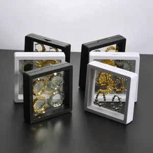 Transparent PE film floating jewelry display boxes with various gold and silver hoop earrings.