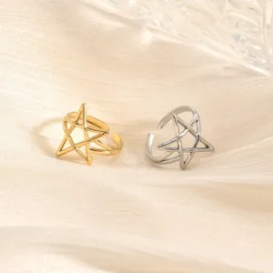Detail shot of minimalist gold and silver pentagram open rings showing smooth polished texture.