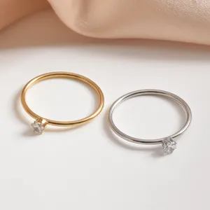 Close-up detail of minimalist double-color stainless steel single stone thin ring set.