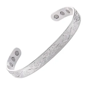 Silver magnetic therapy cuff bracelet with elegant floral engraving, open design for daily wear.