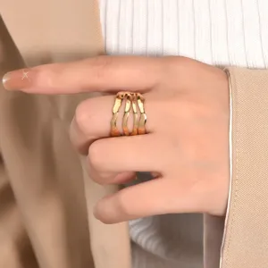 Detailed view of 18k gold multi-strand irregular wavy stainless steel fashion ring.