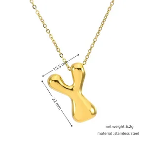 Detail view of the gold puffy letter Y pendant, showing dimension specs and stainless steel.