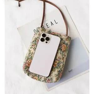 Ethnic floral print small crossbody bag for women, retro tapestry shoulder bag with adjustable strap.